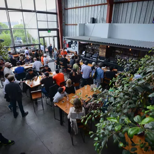 Patrons eat and drink at Southern Pacific Brewing in San Francisco.